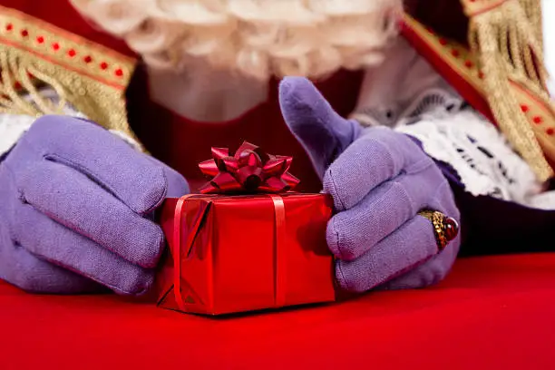 Sinterklaas with gift . typical Dutch character part of a traditional event celebrating the birthday of st.Nicolaas (Santa Claus) in december.