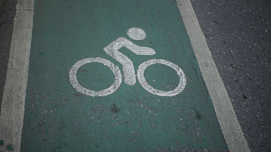 white bike sign lane