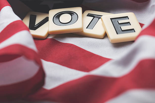 istock Vote on a USA stars and stripes flag 607970586