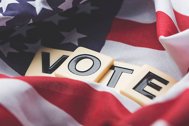 istock Vote on a USA stars and stripes flag 607970618