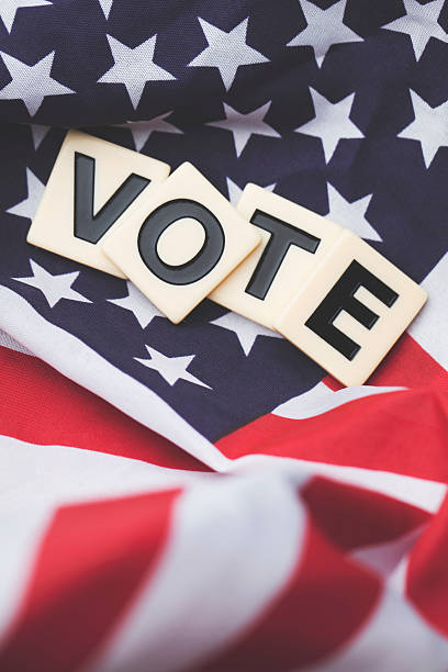 istock Vote on a USA stars and stripes flag 607970642