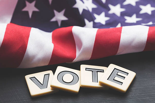 istock Vote on a USA stars and stripes flag 607970744