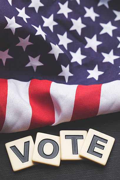 istock Vote on a USA stars and stripes flag 607970786