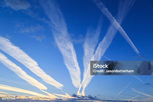 Airplane Chemtrails In Sky Above Nottinghamshire England Stock Photo - Download Image Now