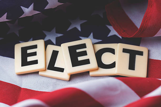istock Elect word on a USA stars and stripes flag 607972210