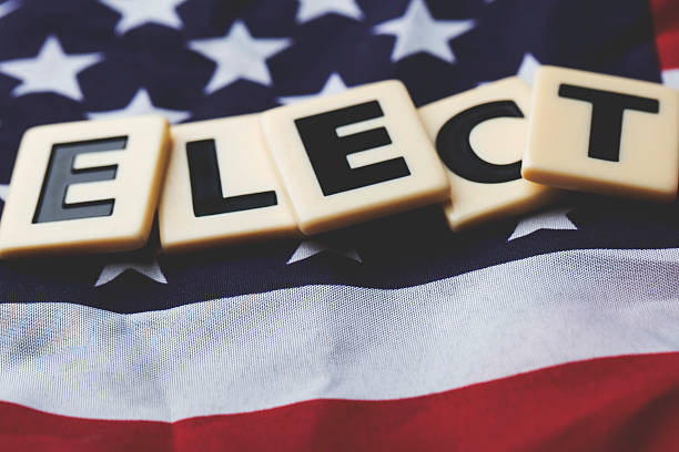 istock Elect word on a USA stars and stripes flag 607972212