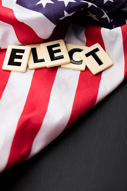 istock Elect word on a USA stars and stripes flag 607972258