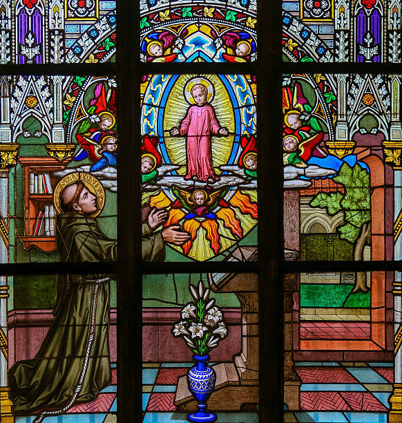 Prague, Czech Republic - April 2, 2016: Stained Glass window in St. Vitus Cathedral, Prague, depicting Saint Anthony of Padua, a Portuguese Catholic priest and friar of the Franciscan Order.
