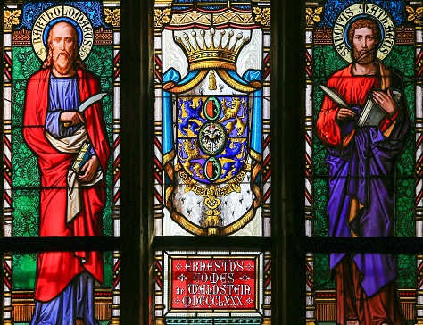 Prague, Czech Republic - April 2, 2016: Stained Glass window in St. Vitus Cathedral, Prague, depicting Saint Matthew the Evangelist and Saint Bartholomew the Apostle