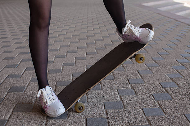 istock Girl's legs on the skateboard 607974518