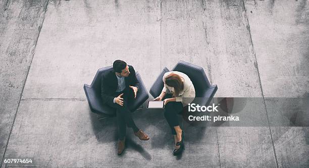 Overhead View Of Two Business Persons In The Lobby Stock Photo - Download Image Now - Two People, High Angle View, Business