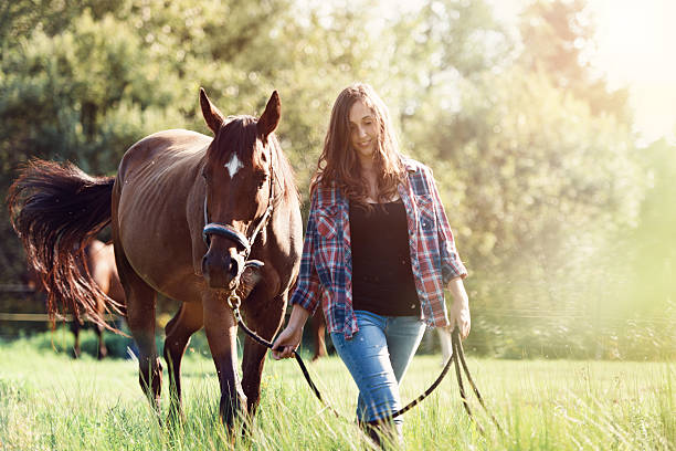 istock Woman with her horse 607975866
