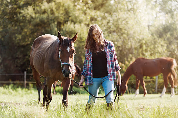 istock Woman with her horse 607976144