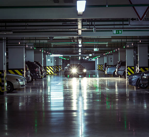 istock Parking garage, underground interior with a parked cars 607978334