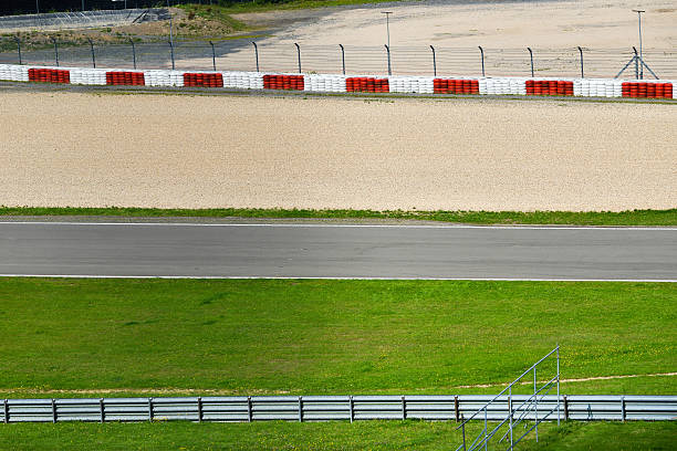 istock View from the pole position in a racetrack. 607978618