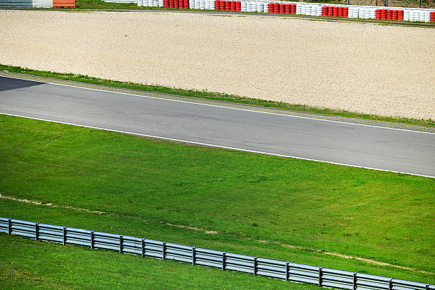 istock View from the pole position in a racetrack. 607978828