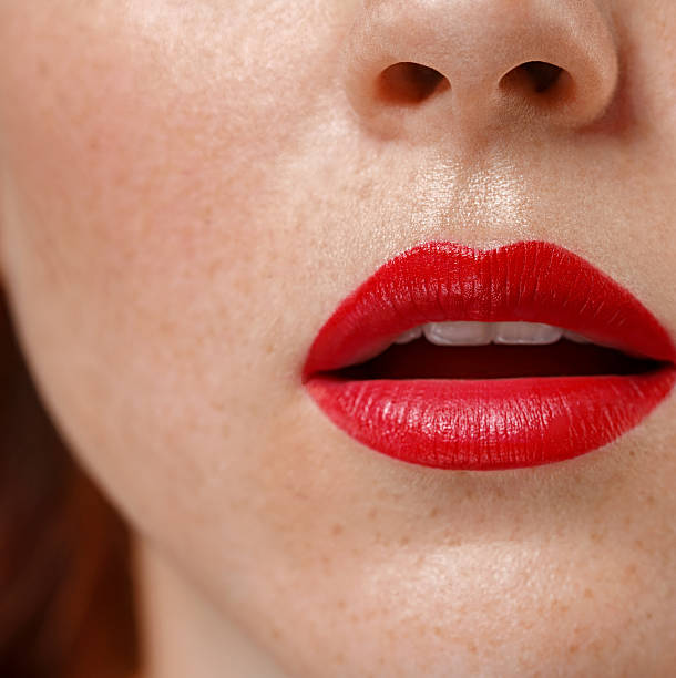 istock Woman lips close up red lipstick 607981768