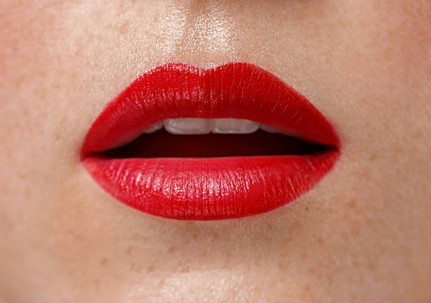 istock Woman lips close up red lipstick 607981870