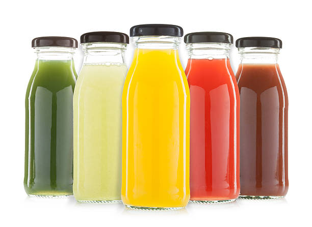 istock Vegetable and fruit juice bottles isolated 607982974