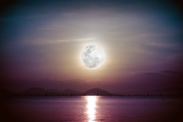 istock Romantic scenic with full moon on sea to night. 607983726
