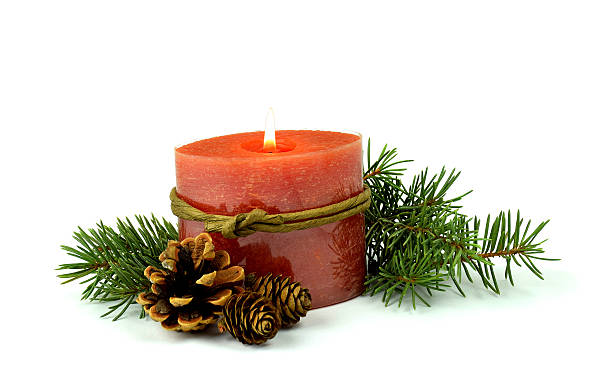 istock Little Christmas composition, a burning candle, fir ,cones. / Isolated / 607988414