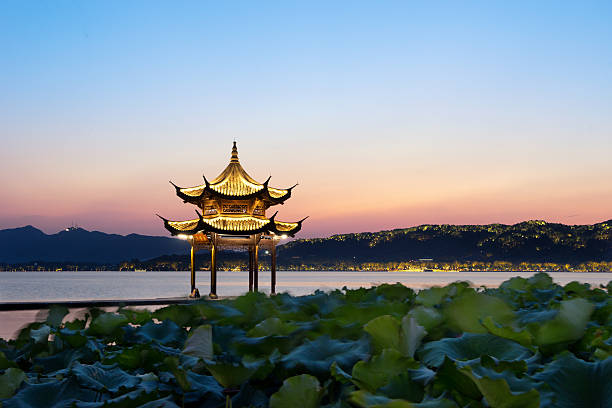 chinese ancient pavilion with sunset at the west lake in hangzhouchinese ancient pavilion with sunset at the west lake in hangzhou