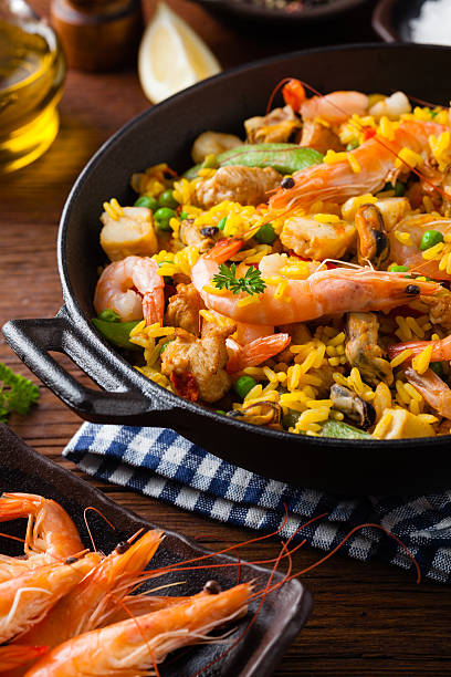 istock Traditional Spanish paella with seafood and chicken. 607990834