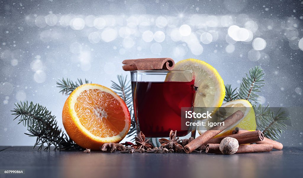 Mulled wine with spices Mulled wine with spices on a black table Alcohol - Drink Stock Photo