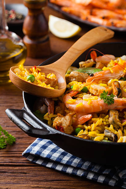istock Traditional Spanish paella with seafood and chicken. 607990932
