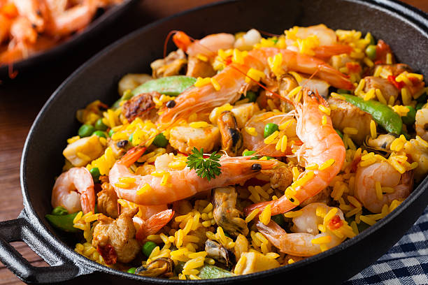 istock Traditional Spanish paella with seafood and chicken. 607991016