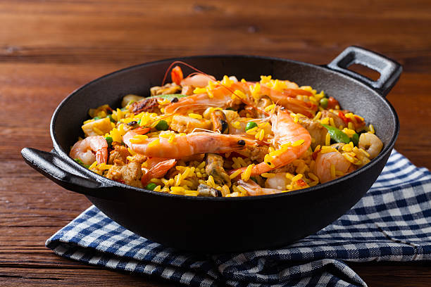 istock Traditional Spanish paella with seafood and chicken. 607991122