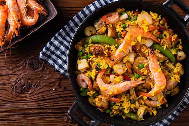 istock Traditional Spanish paella with seafood and chicken. 607991252