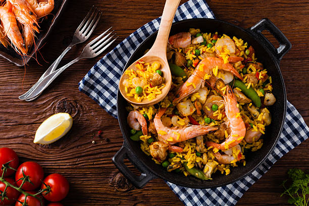 istock Traditional Spanish paella with seafood and chicken. 607991402