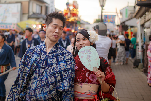 Japanese Yukata couple walking on festive street