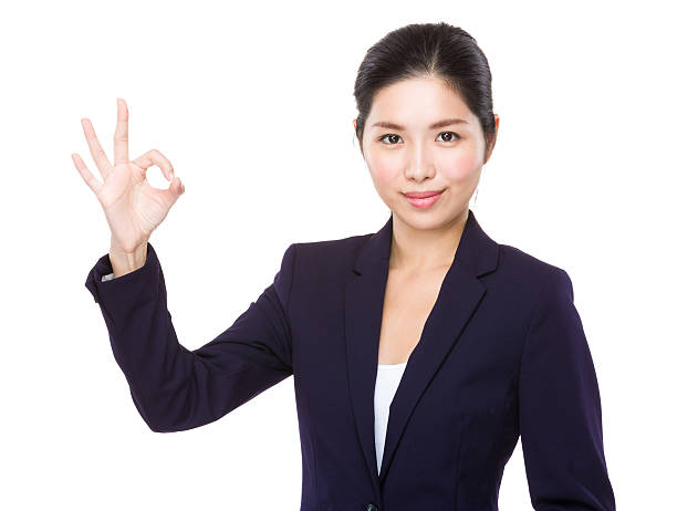 istock Businesswoman making ok sign 607992618