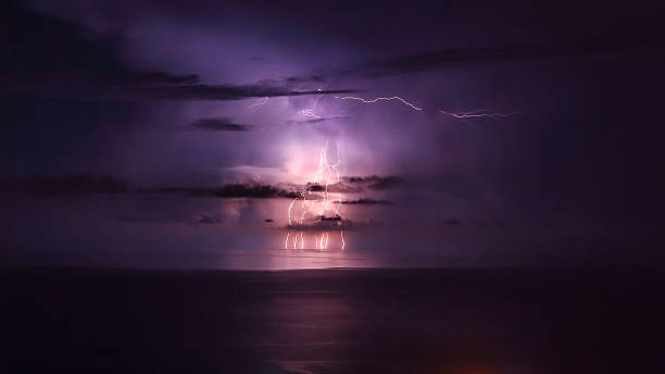 istock Purple lightning over the sea 607993526