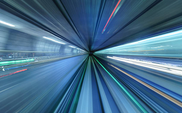 istock Motion blur of train moving inside tunnel in Tokyo, Japan 607994620