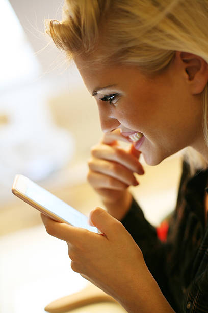 istock Smiling Caucasian woman texting message. 607997060