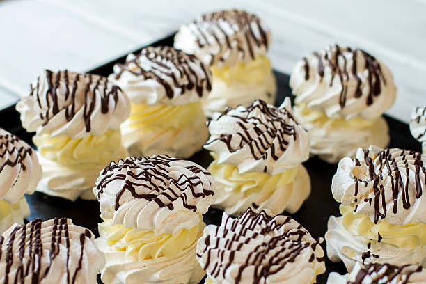 istock Meringues with yellow cream. 607997762