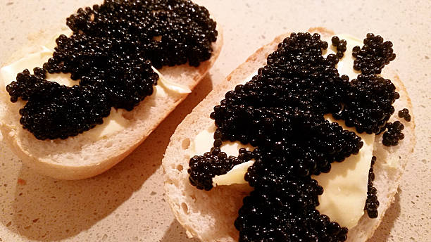 istock Sandwiches with black caviar 607998278