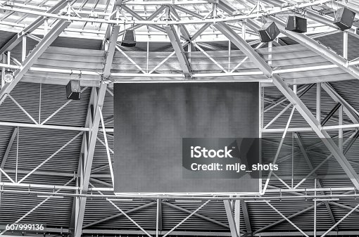istock Modern stadium roof construction and LED display 607999136