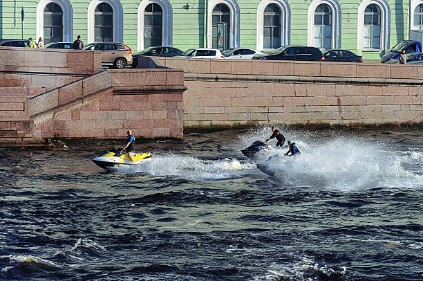 Three men on jet ski in St. Petersburg stock photo