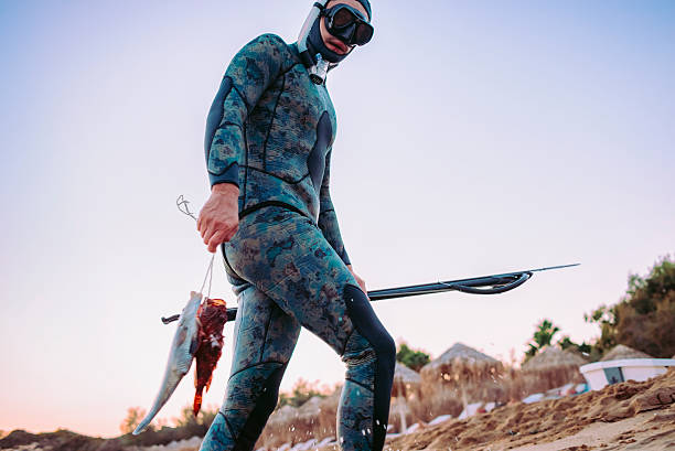 istock spear fisherman coming back from the sea 608000778
