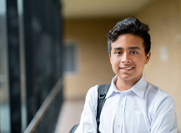 Happy boy at school Portrait of a happy boy at school looking at the camera smiling - education concepts school boy in uniform stock pictures, royalty-free photos & images