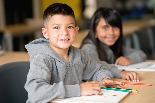 Happy boy at the school Portrait of a happy boy at the school looking at the camera smiling small boys stock pictures, royalty-free photos & images
