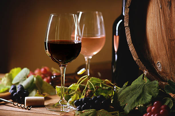 istock Wine bottle, glasses, grapes and barrel 608003430