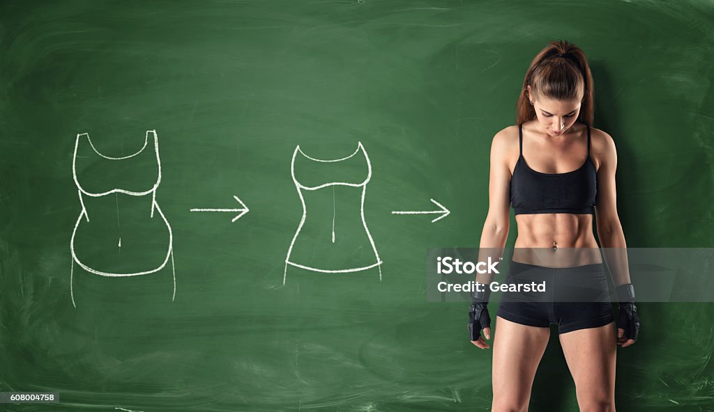 Concept of how a girl's body changing Concept of how a girl's body changing - from fat belly to perfect waist and abs on the background of a chalkboard. Self-improvement and sport. Athletic body. Workout and fitness. Exercising Stock Photo