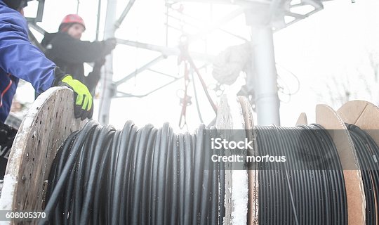 istock Telecommunication manual high worker engineer climbing an antenna 608005370