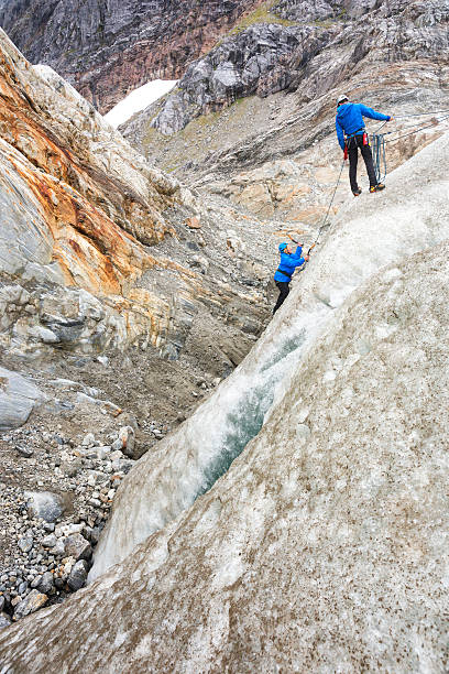istock Woman gains confidence ice climbing 608005614