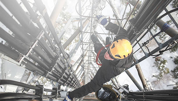 istock Telecommunication manual high worker engineer repairing antenna 608005938